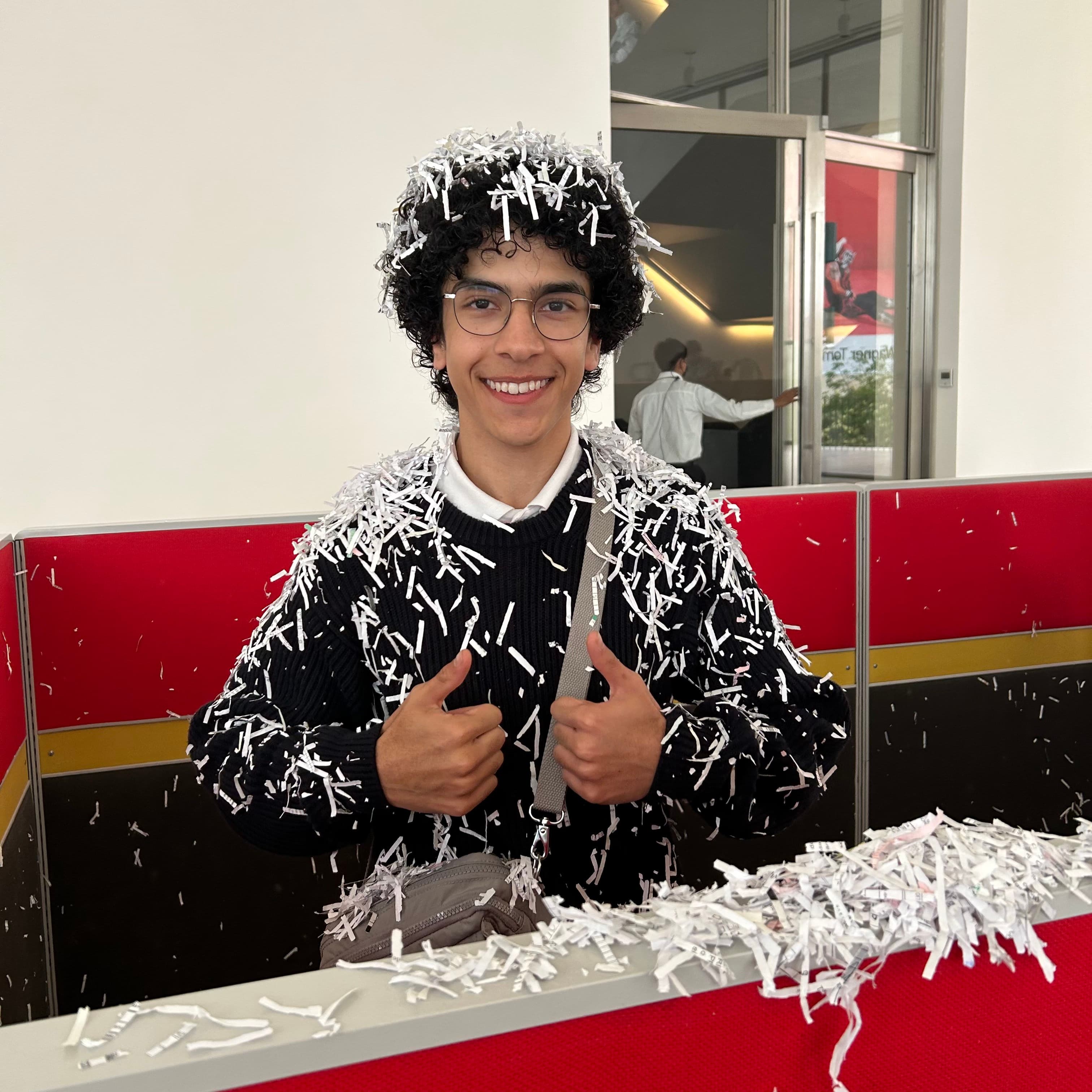Jonathan covered in shredded paper at Museo Jumex